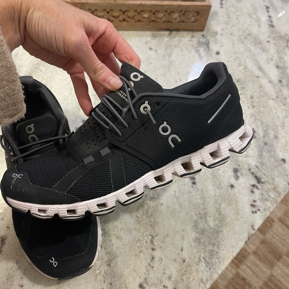 On Running Black and White Athletic Shoes with CloudTec